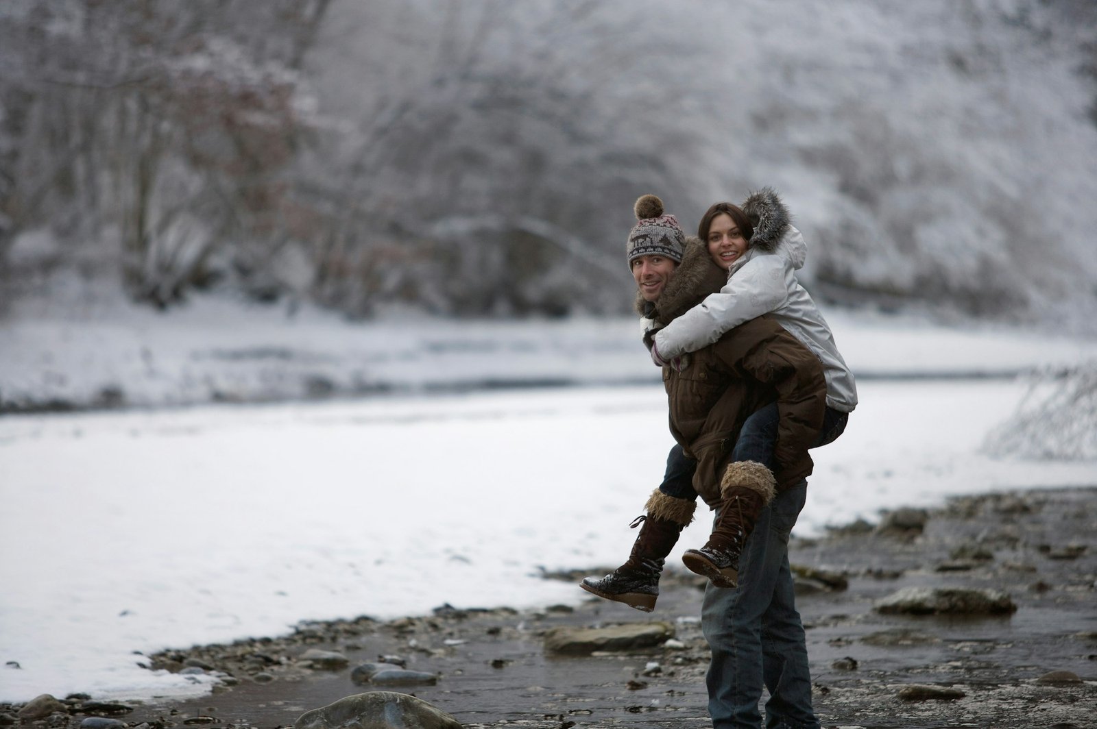 Couple walking in the snow.